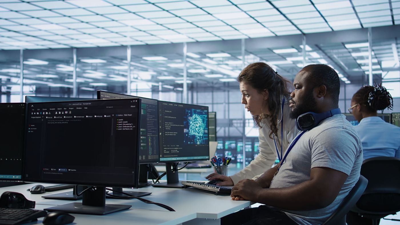 IT engineers monitoring servers and dashboards in a data operations centre